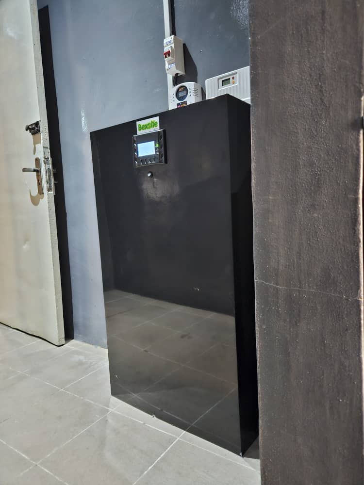 Indoor hallway lithium battery storage installation with cooling fan
